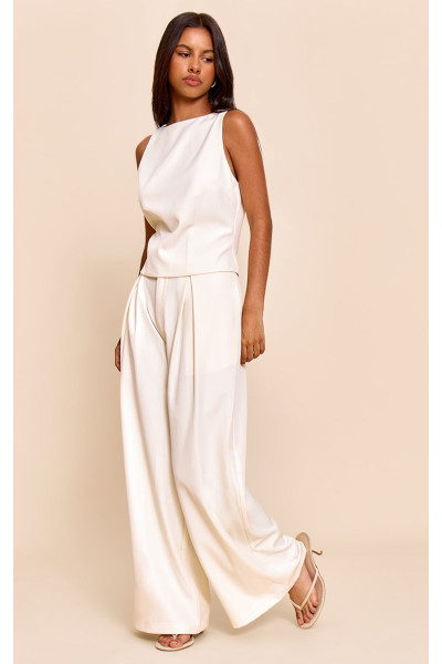 Маленькі кремові штани з широкими ногами