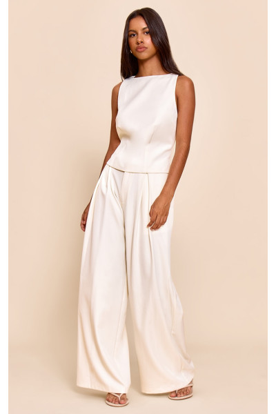 Маленькі кремові штани з широкими ногами