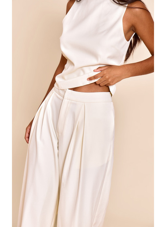 Маленькі кремові штани з широкими ногами