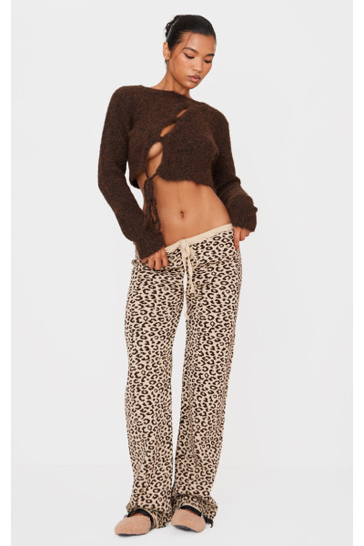 Коричневі широкі трикотажні штани з леопардовим принтом